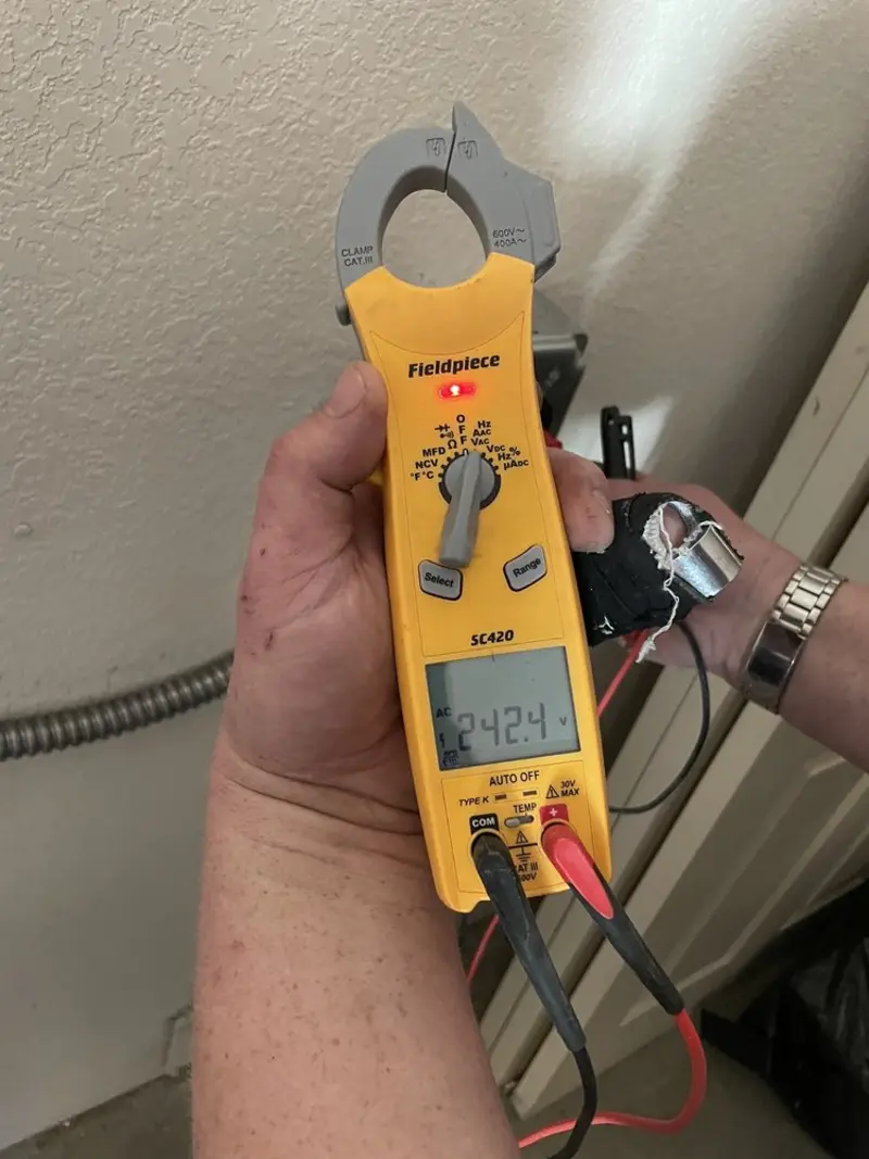 Voltage testing with clamp meter during Generator Installation in Glendale Heights